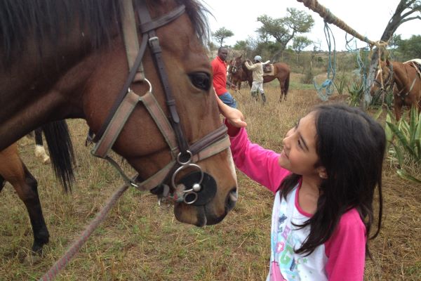Child with horse at Borana Riding Lodge