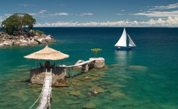 Snorkellers, Lake Malawi and jetty and sail boat