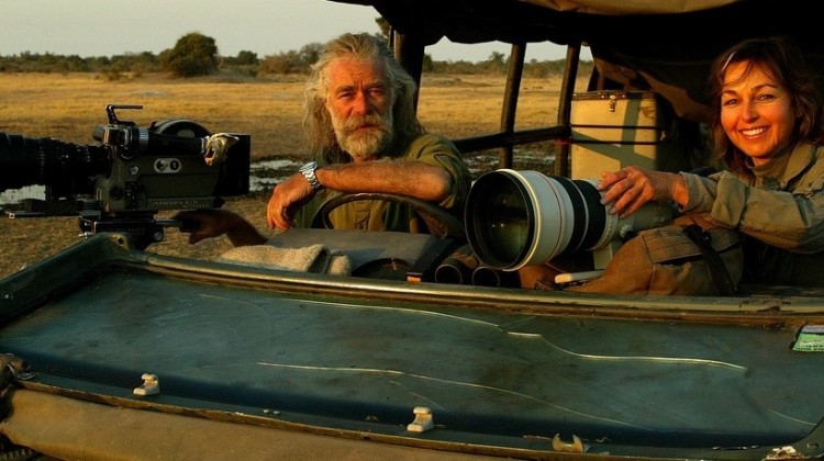 National Geographic photographers Dereck and Beverly Joubert - in their safari vehicle with long range lenses