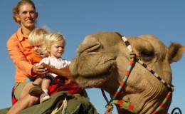 Karisia Camel Walking Safari young children riding with mother on camel