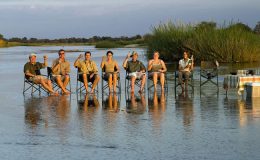solo safari - walkers cooling off in a river in Zambia