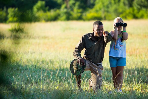Great Plains Guide with child and binoculars