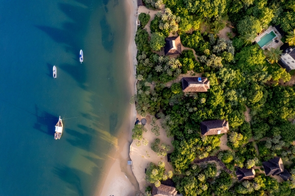 The Cabanas, seen perched amongst the trees, on the beach edge