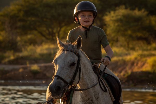 kids riding safari