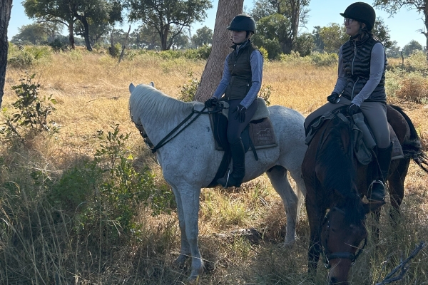 Two riders on their horses at African horseback Safaris Botswana